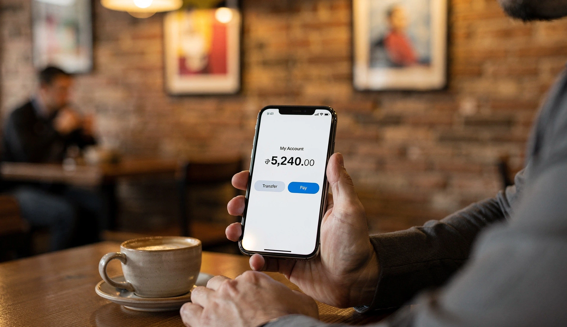 Using a banking app at a café in Tbilisi — Georgian mobile banking is genuinely world-class