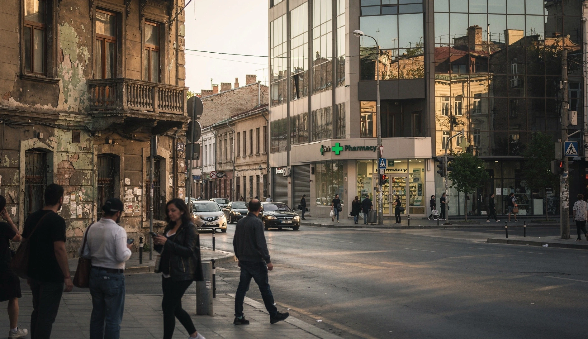 Tbilisi Old Town street with parked cars and traditional balconies