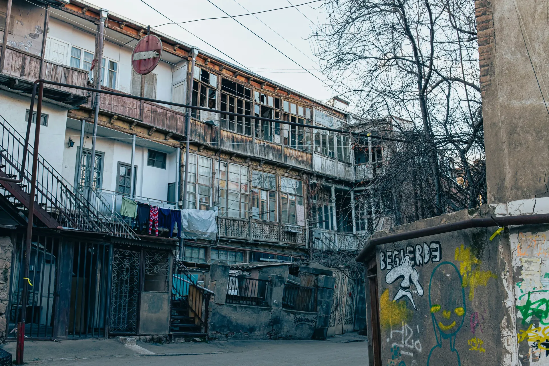 Traditional Tbilisi apartment buildings with ornate balconies and carved facades